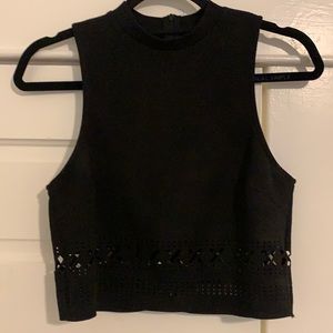 High neck. Crop black tank with cutouts